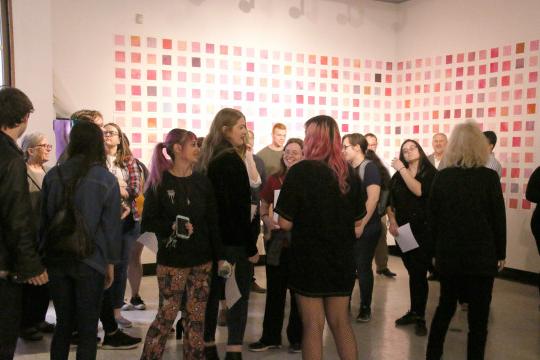 Art students gather for senior thesis exhibitions.